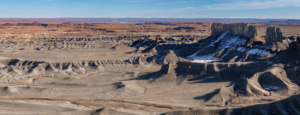 Moonscape Overlook near Factory Butte in Utah’s badlands with eroded ridges, desert mesas, and dramatic morning light.