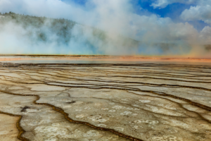 Geothermal terraces and steam rising from Grand Prismatic Spring in Yellowstone National Park