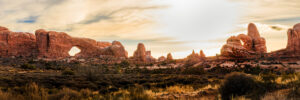 Panorama of Turret Arch and Windows Section in Arches National Park at sunrise